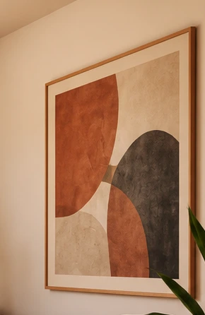 Oak-framed abstract Wall Art in cream, terracotta and charcoal. Concept imagery.